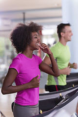 Image showing people exercisinng a cardio on treadmill