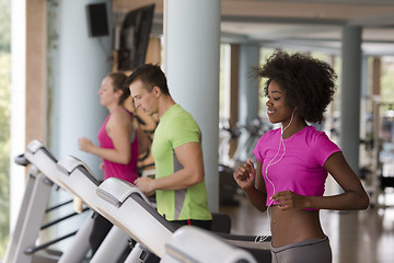 Image showing people exercisinng a cardio on treadmill in gym