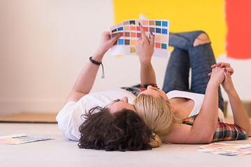 Image showing Happy young couple relaxing after painting