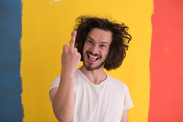 Image showing young man with funny hair over color background