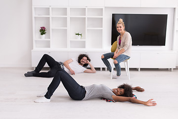 Image showing multiethnic group of people relax in their new apartment