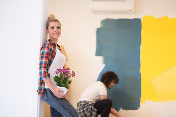 Image showing happy young couple doing home renovations