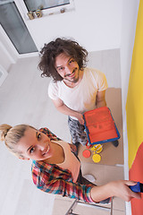 Image showing couple painting interior wall