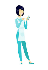 Image showing Asian cleaner holding a mobile phone.