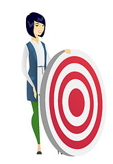 Image showing Young business woman and dart board.