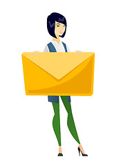 Image showing Smiling business woman holding a big envelope.