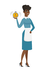 Image showing African cleaner holding alarm clock.