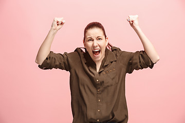 Image showing Winning success woman happy ecstatic celebrating being a winner. Dynamic energetic image of female model