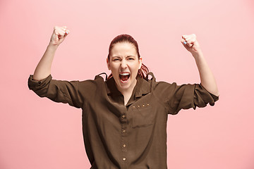 Image showing Winning success woman happy ecstatic celebrating being a winner. Dynamic energetic image of female model