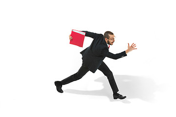 Image showing Businessman running with a folder on white background