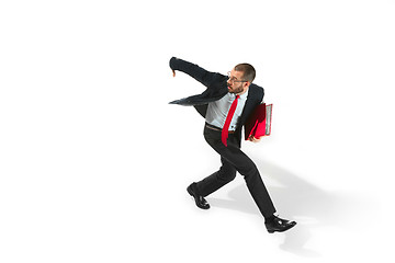 Image showing Businessman running with a folder on white background