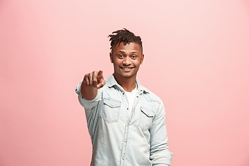 Image showing The happy businessman point you and want you, half length closeup portrait on pink background.