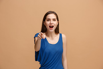 Image showing The happy woman point you and want you, half length closeup portrait on pastel background.