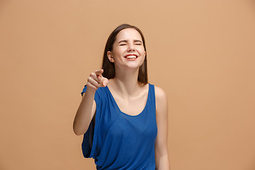 Image showing The happy woman point you and want you, half length closeup portrait on pastel background.