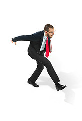 Image showing Businessman running with a folder on white background