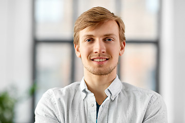 Image showing portrait of happy smiling man at office