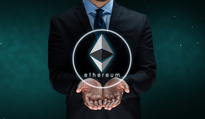 Image showing close up of businessman with ethereum over space