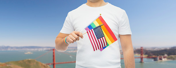 Image showing man with gay pride rainbow flag and wristband