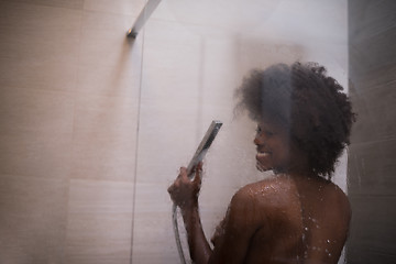 Image showing African American woman in the shower