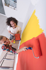 Image showing couple painting interior wall