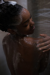 Image showing African American woman in the shower