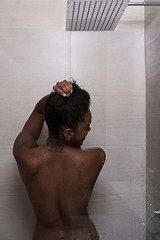 Image showing African American woman in the shower