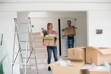 Image showing young couple moving into a new home