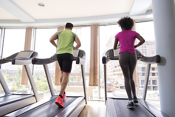 Image showing people exercisinng a cardio on treadmill in gym