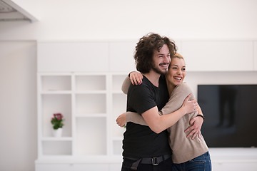 Image showing couple hugging in their new home