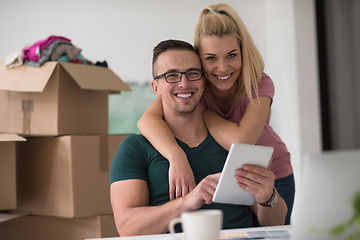 Image showing Young couple moving in a new home