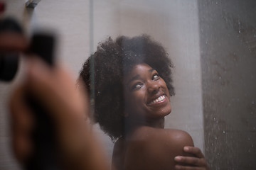 Image showing African American woman in the shower