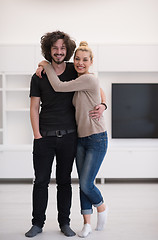 Image showing couple hugging in their new home