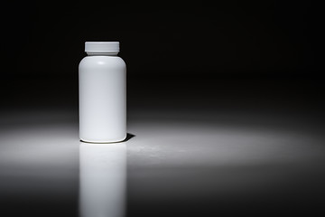 Image showing Blank White Bottle Ready For Your Text Under Spot Light.