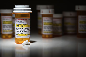 Image showing Hydrocodone Pills and Prescription Bottles with Non Proprietary 