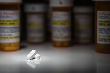 Image showing Hydrocodone Pills and Prescription Bottles Under Spot Light.