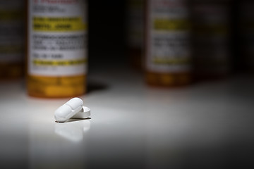 Image showing Hydrocodone Pills and Prescription Bottles Under Spot Light.