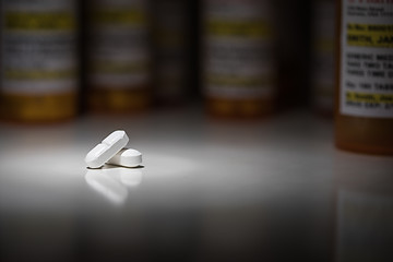 Image showing Hydrocodone Pills and Prescription Bottles Under Spot Light.