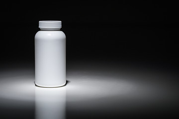 Image showing Blank White Bottle Ready For Your Text Under Spot Light.