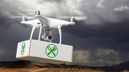 Image showing Unmanned Aircraft System (UAV) Quadcopter Drone Carrying Package