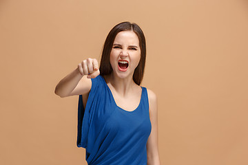 Image showing The overbearing woman point you and want you, half length closeup portrait on pastel background.