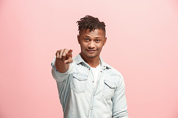 Image showing The happy businessman point you and want you, half length closeup portrait on pink background.