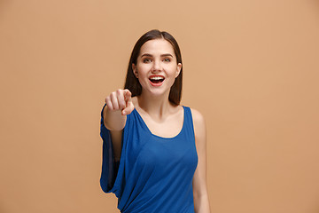 Image showing The happy woman point you and want you, half length closeup portrait on pastel background.