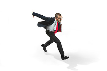 Image showing Businessman running with a folder on white background