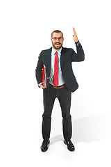 Image showing Choose me. Full body view of businessman with red folder on white studio background