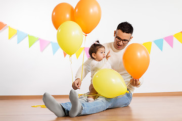 Image showing father and daughter with birthday party balloons