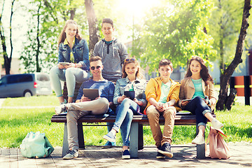 Image showing group of students with tablet pc at school yard