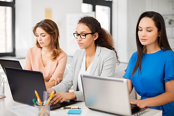 Image showing businesswomen with laptop working at office