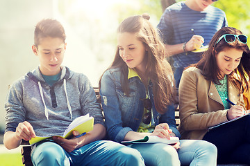 Image showing group of students with notebooks at school yard