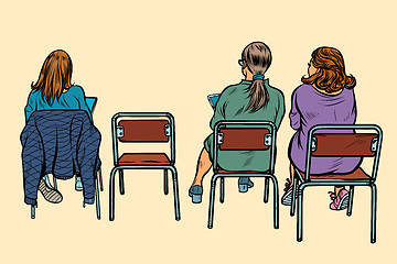 Image showing women sit back on chairs