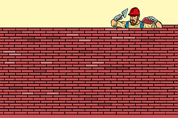 Image showing The Builder lays brick masonry at the top